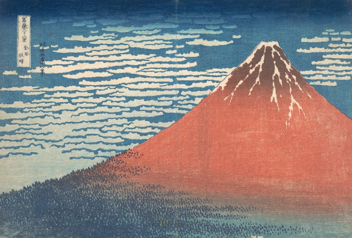 a print of a pink mountain and blue water and trees surrounding