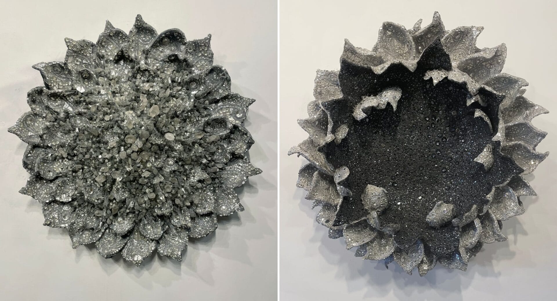 left: a floral sculpture with numerous leaves all covered in glimerring stones and crystals. right: a floral wall sculpture with black glimmering stones in the center and silver petals