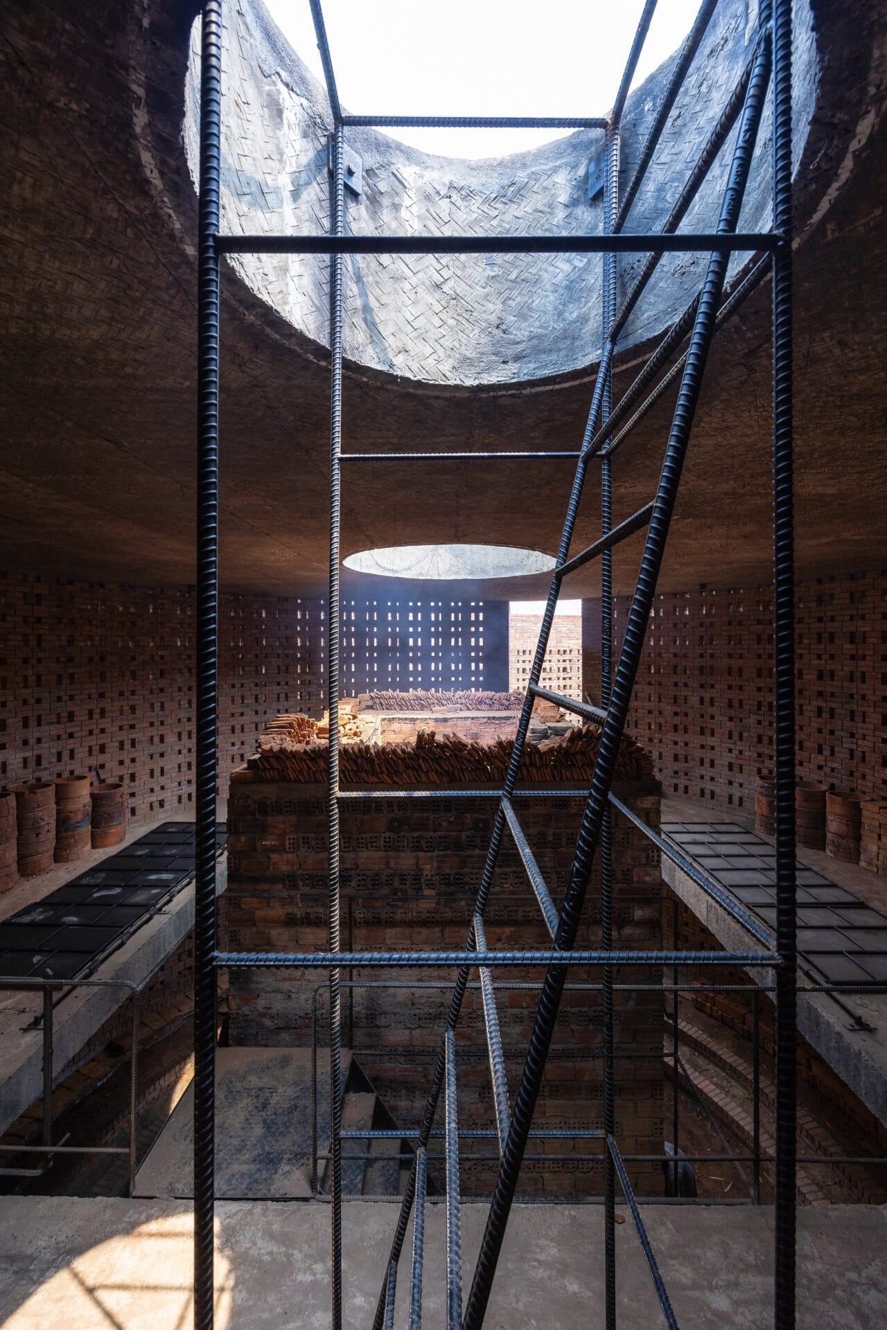the inside of the kiln with scaffolding and an open top