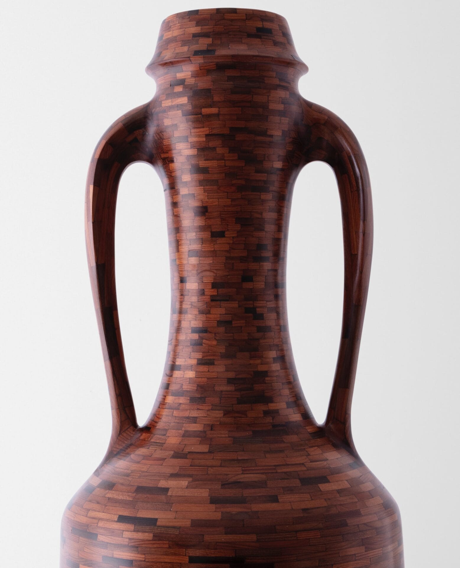a detail of a wooden amphora made of small components