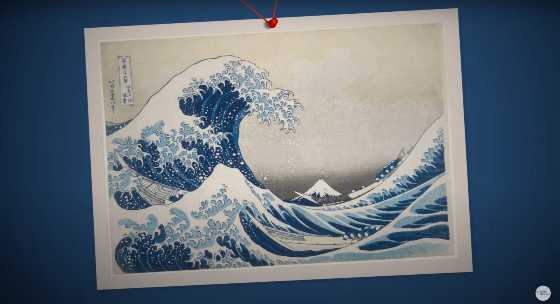 a still from a short documentary about Hokusai's "The Great Wave" print, showing a the print on a blue background