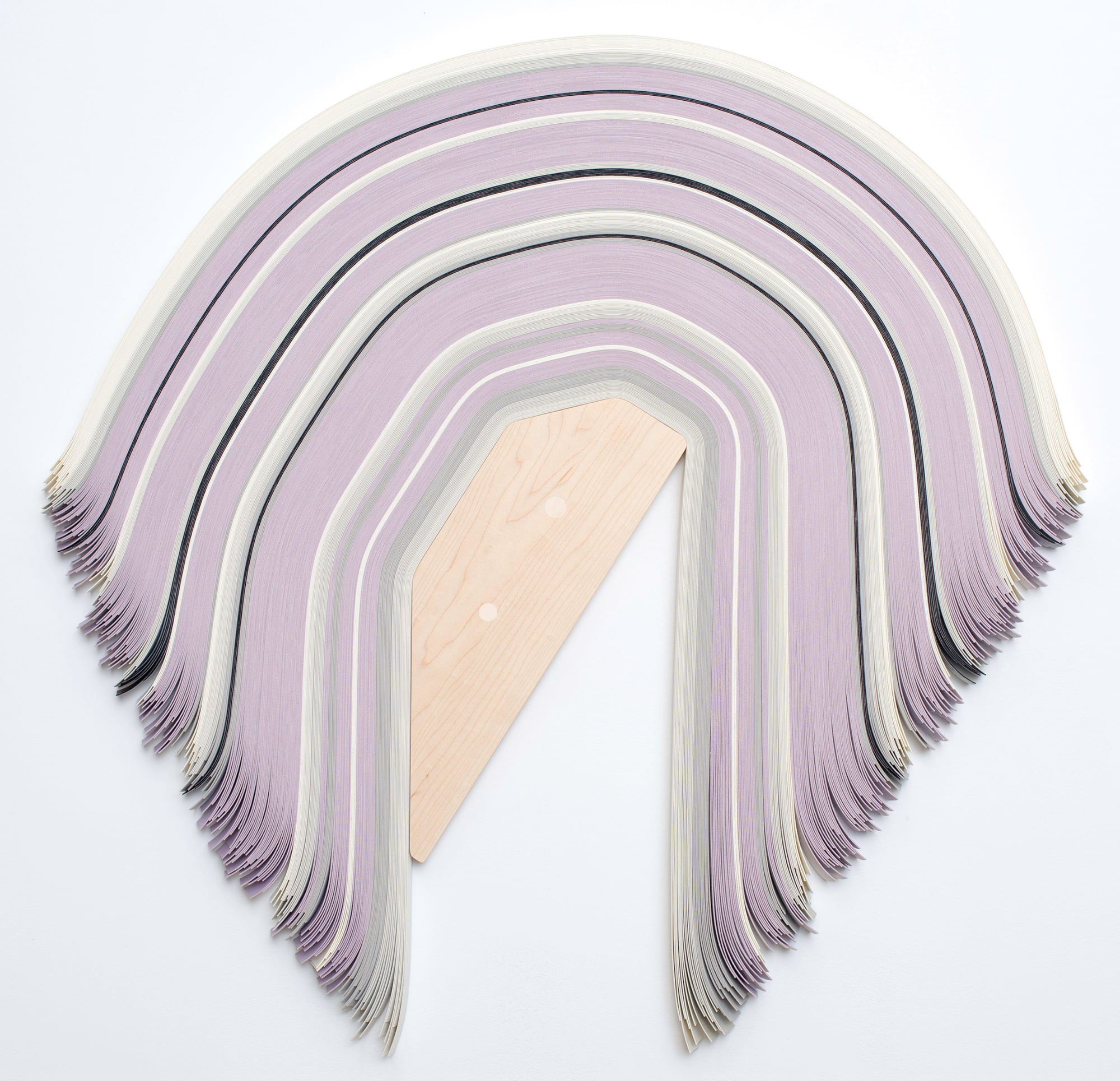 black, gray, purple, and beige vinyl strips slump in a striped pattern across a wooden triangle