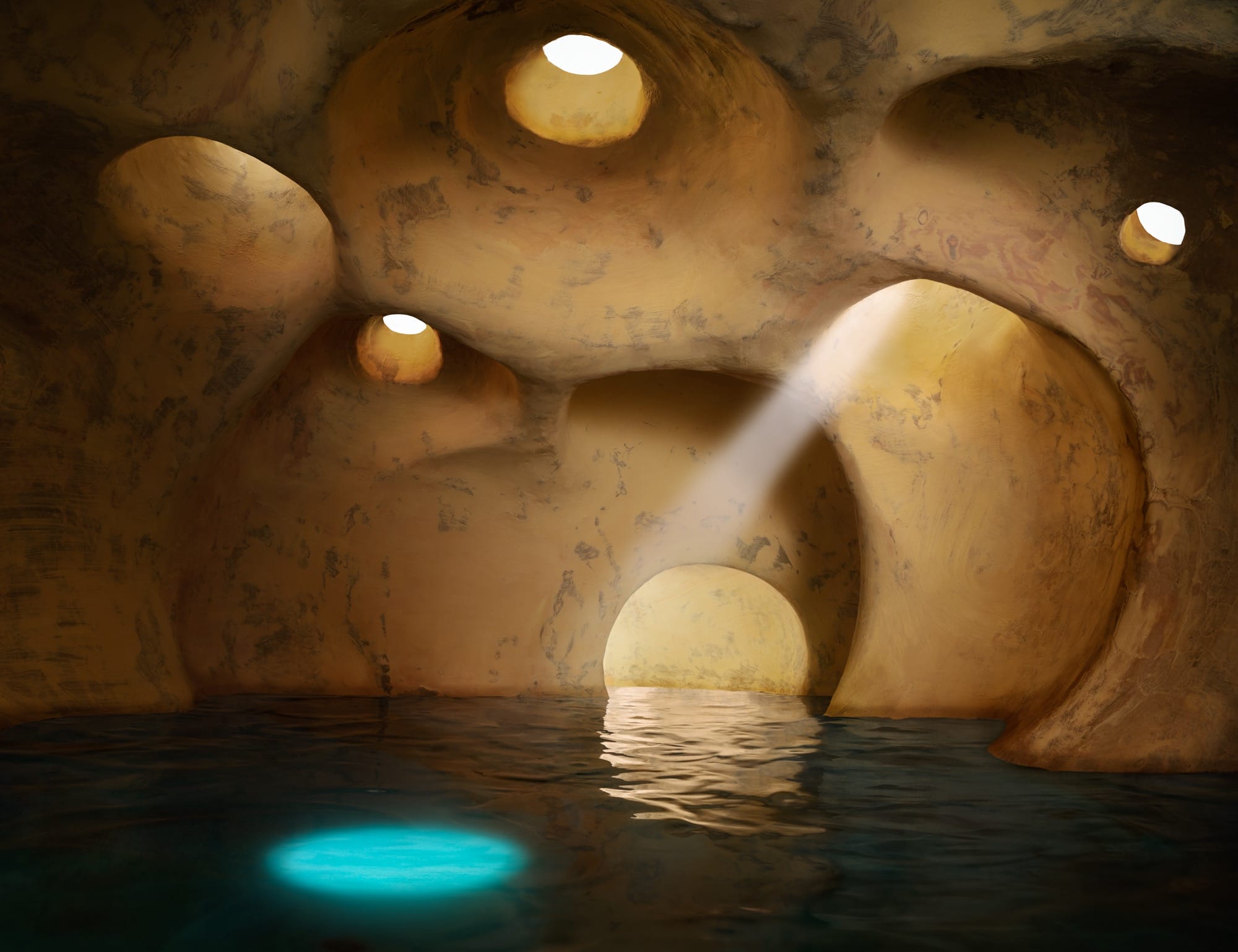 light shines through a cave like cavern hole and peers down to a body of water