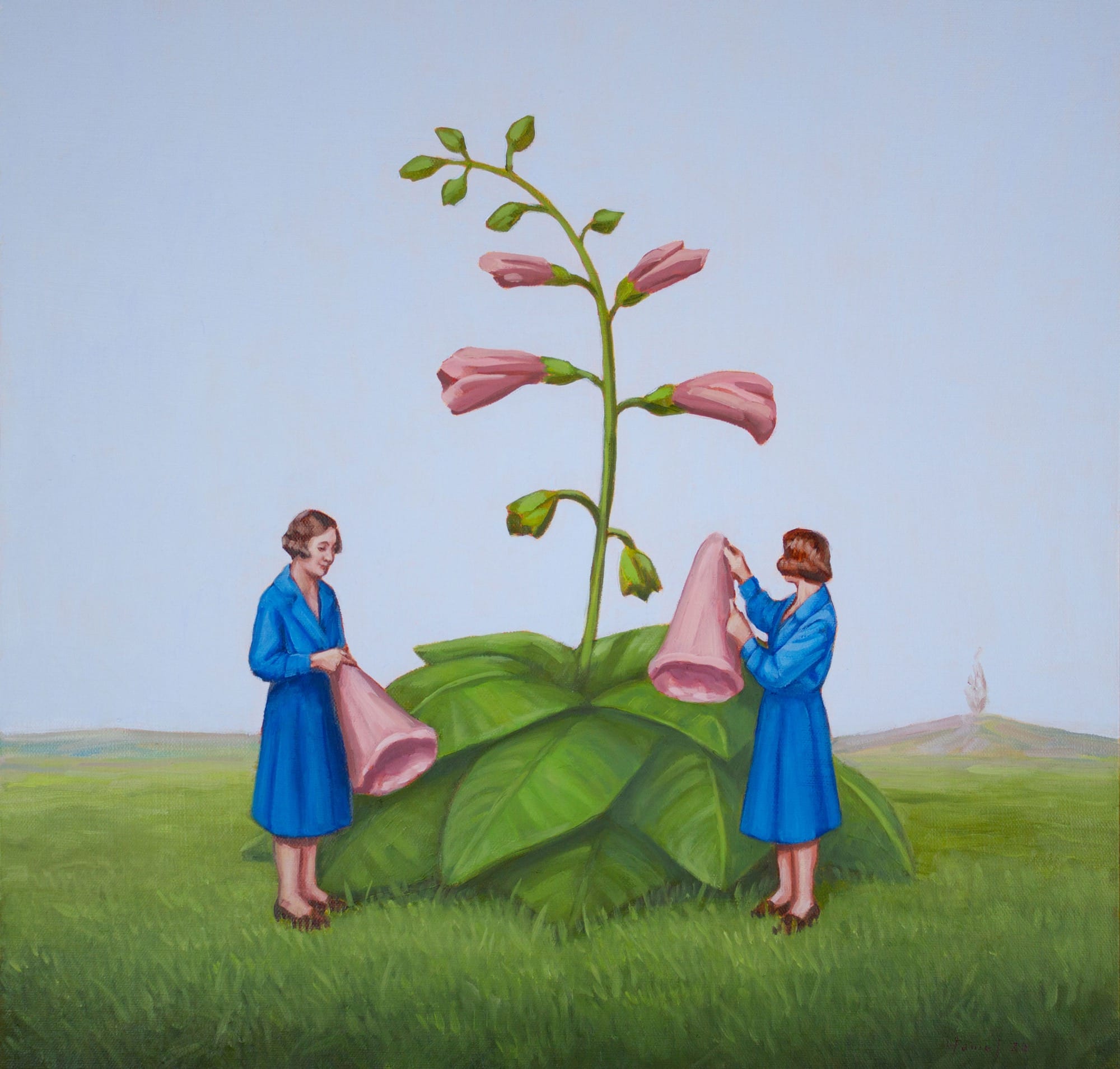 two women in blue dresses attach pink flowers to a large plant